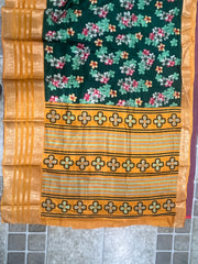 Elegant Dark Green Floral Printed Dola Silk Saree with Zari Border – Festival & Wedding Wear Silk Blend Saree