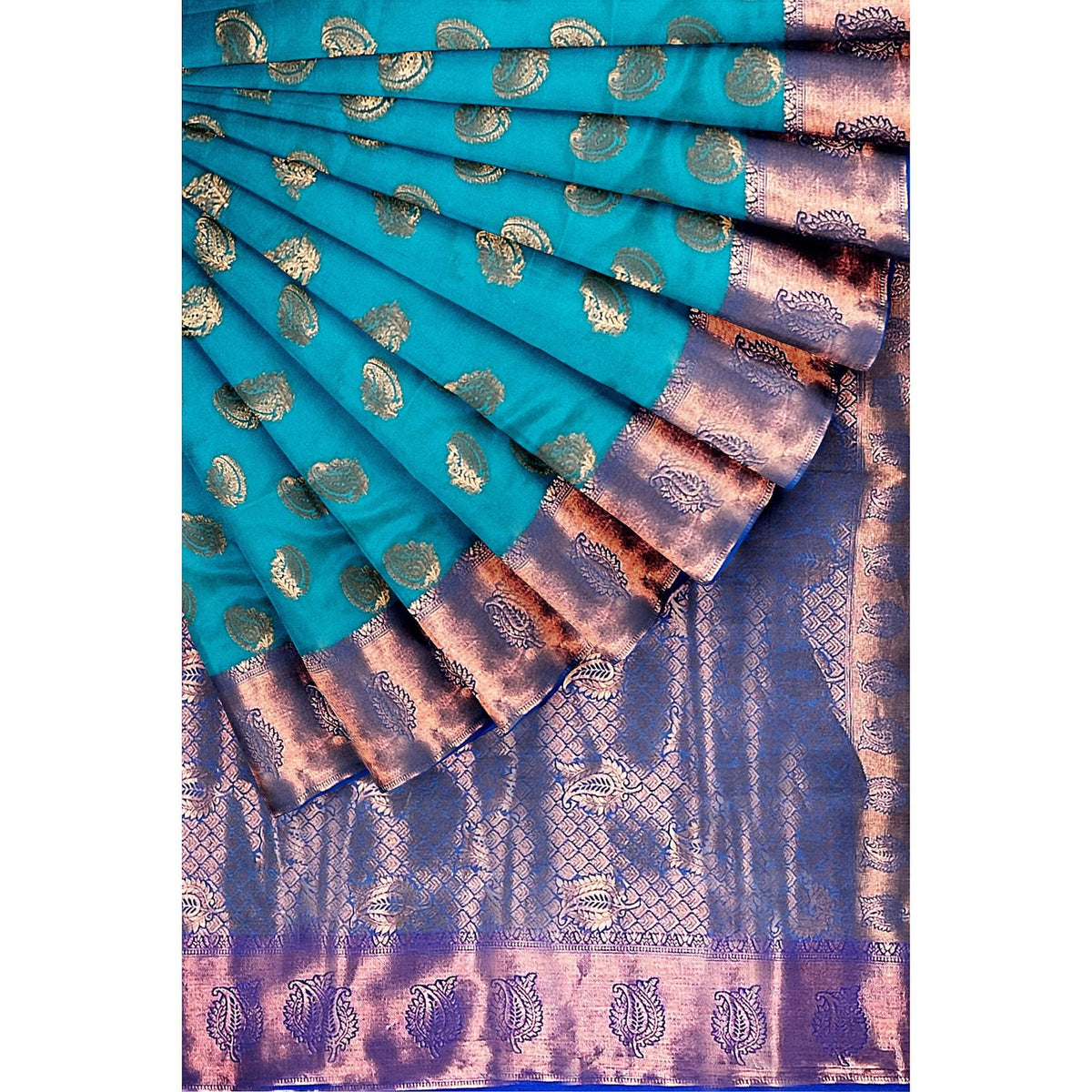 Handwoven Kanchi silk saree in turquoise with gold zari motifs and a purple-bordered edge.